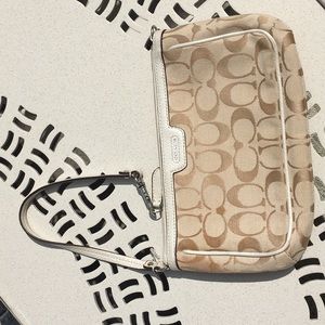 coach wristlet , light beige